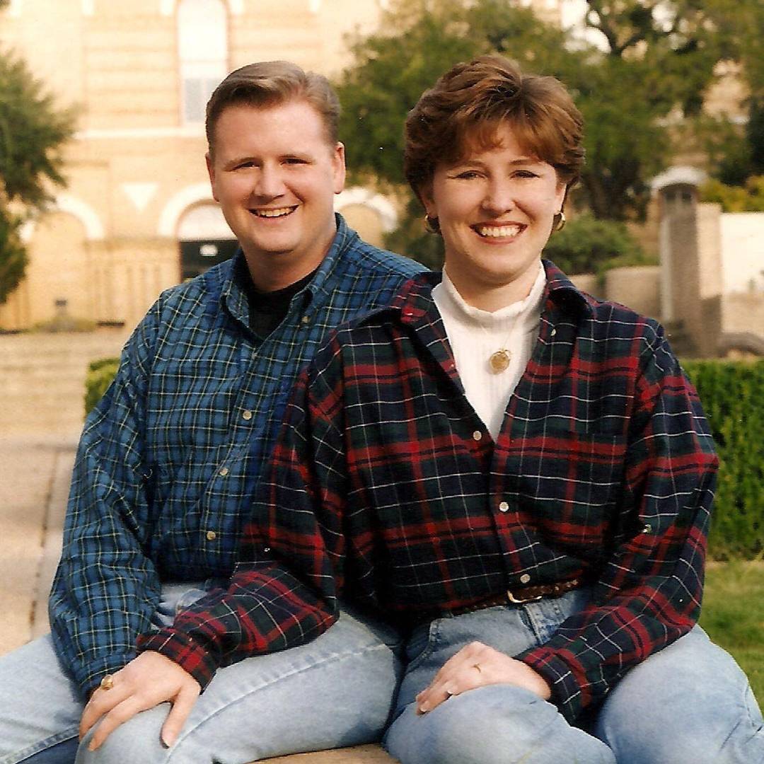 photo of couple sitting together and smiling