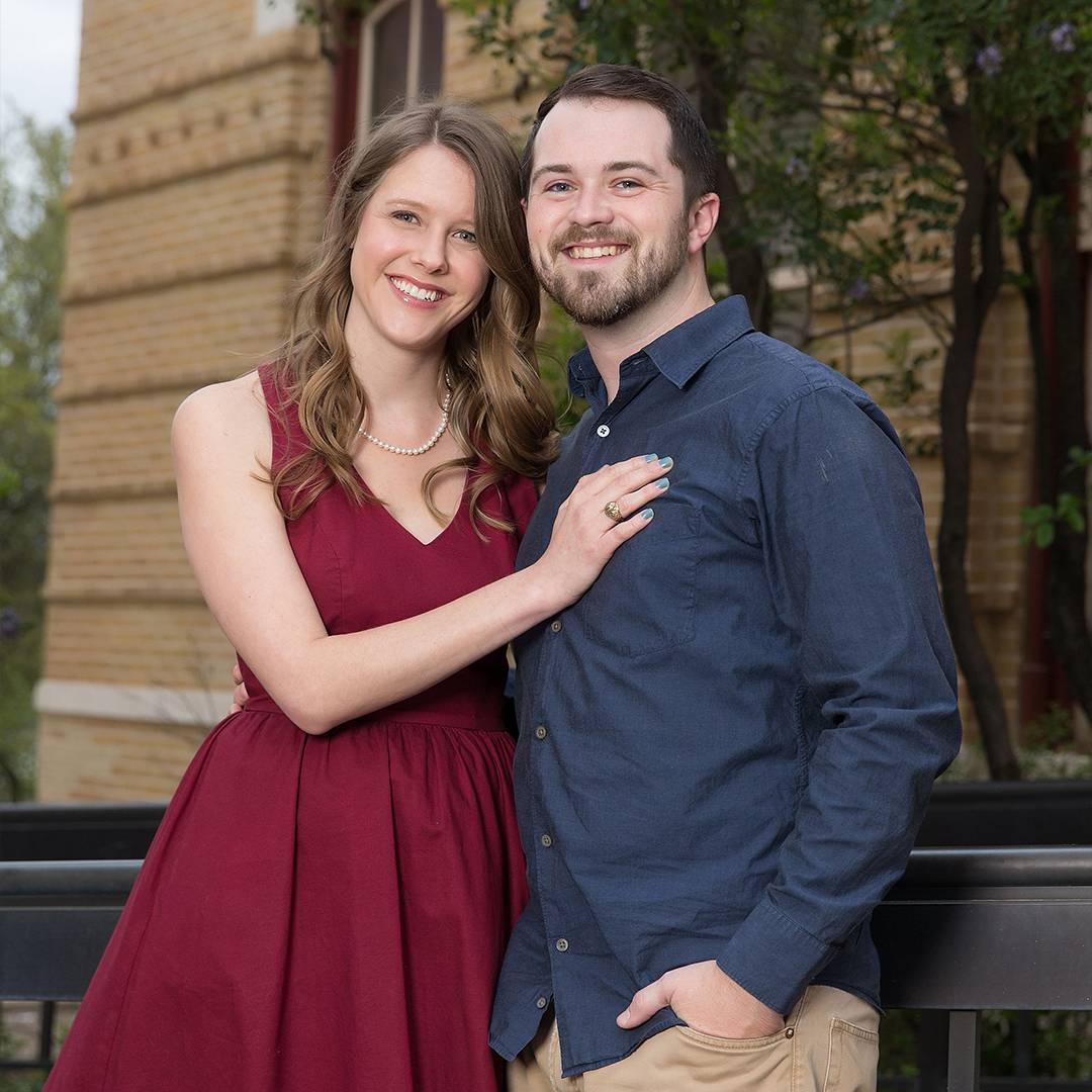 Photo of couple standing together and smiling