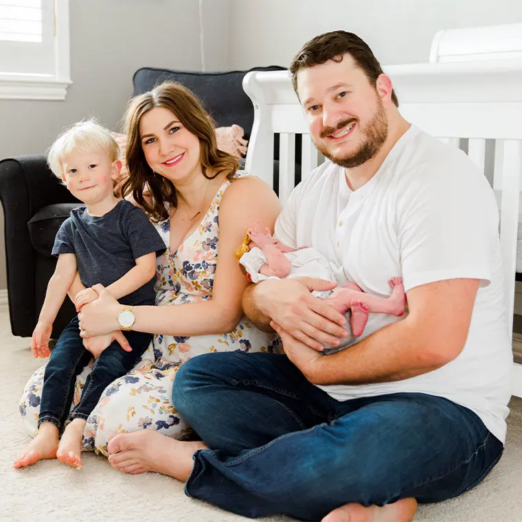 Family photo of couple with two babies