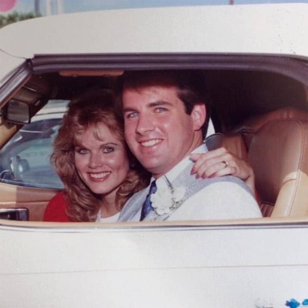 photo of couple hugging each other in a car, vintage tint on photo