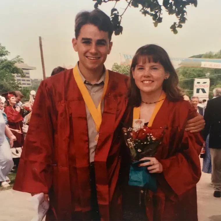 photo of couple at graduation wearing SWT robes