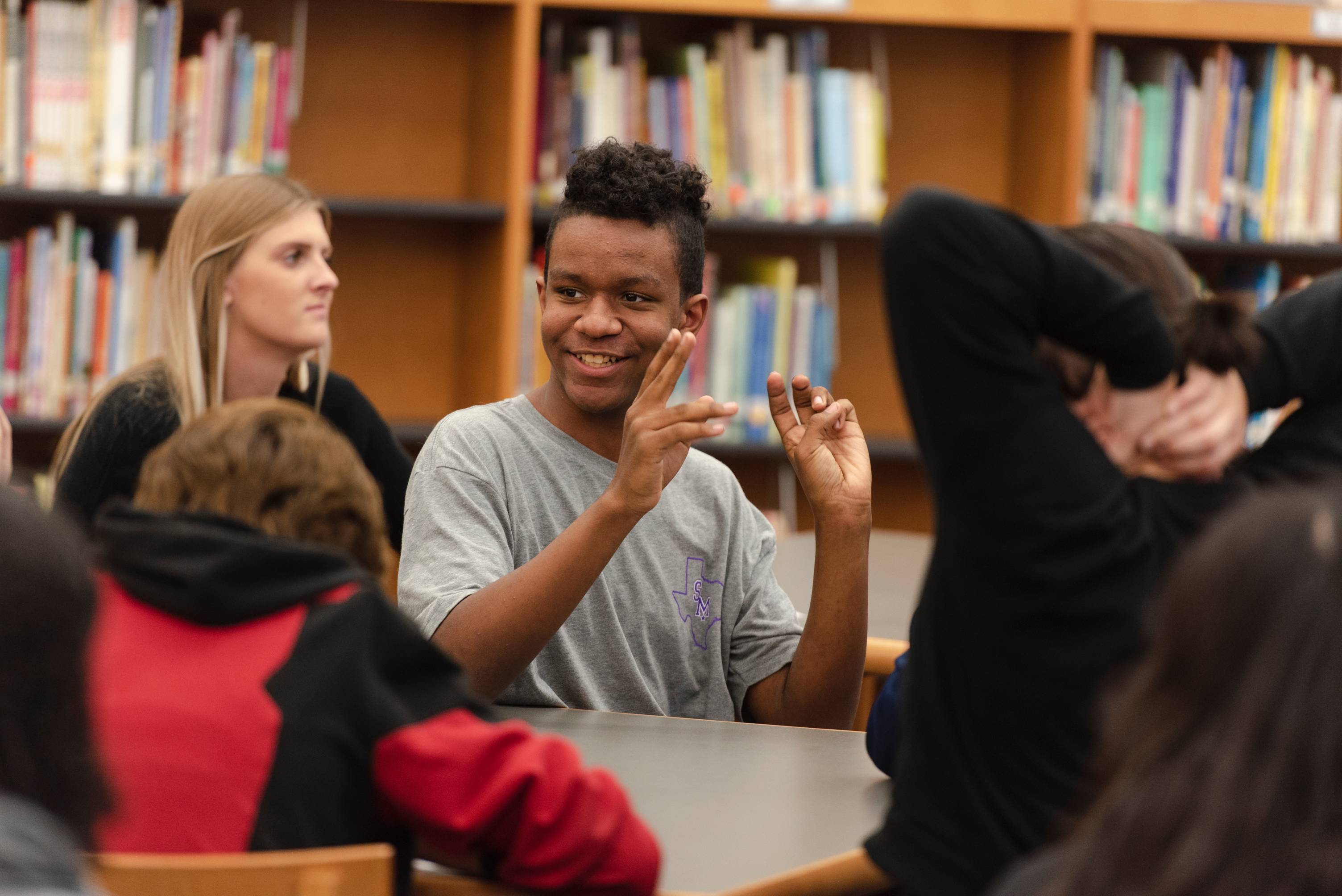 African American student in library smiling