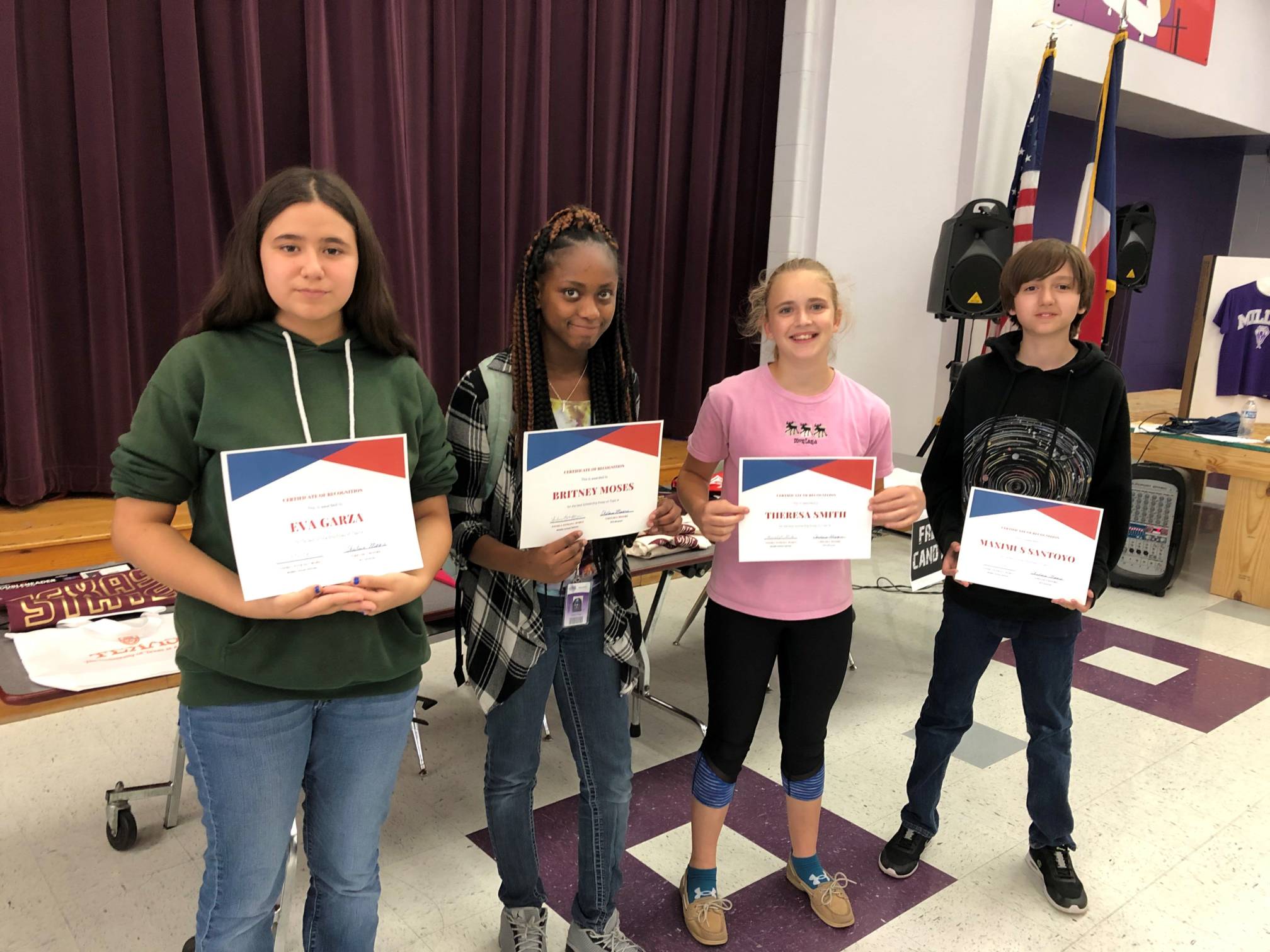 4 students showing certificates from Talent Search