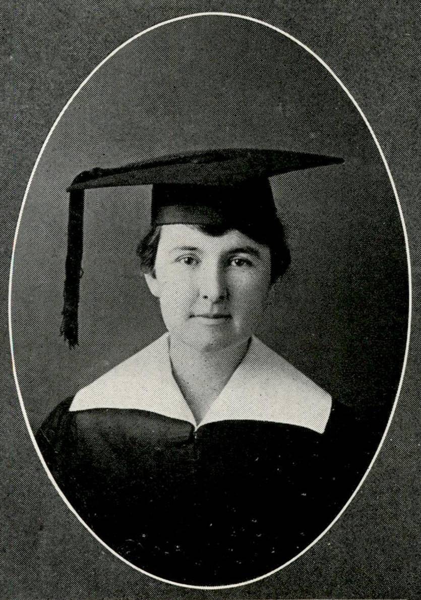 Black and white graduation portrait of Mamie Brown. She's a fair-skinned young woman, with her hair pulled back. She's wearing graduation robes with a large white collar and a mortarboard hat with the tassel hanging down her right side.