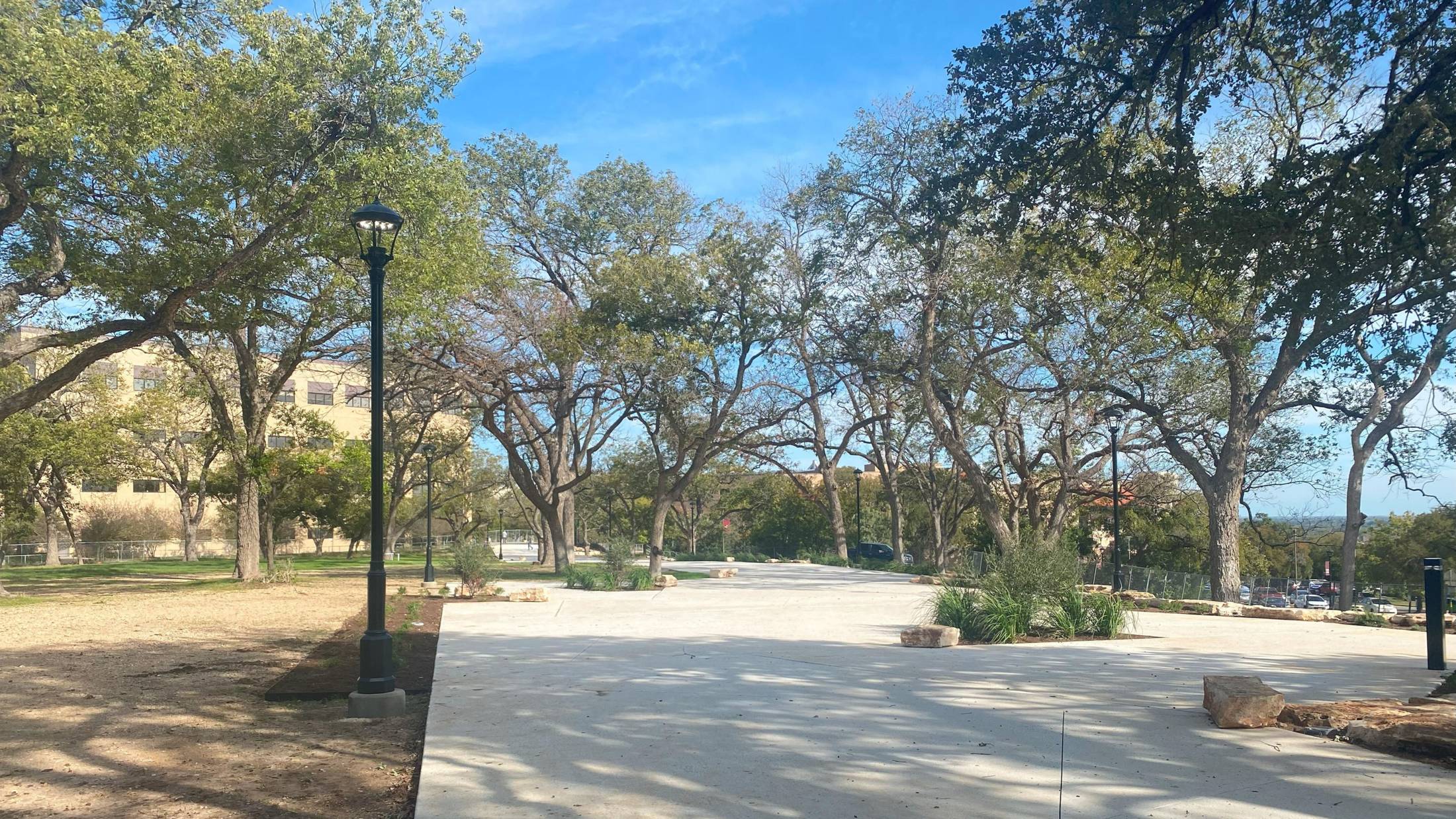 East West Mall paved trail with trees, daytime