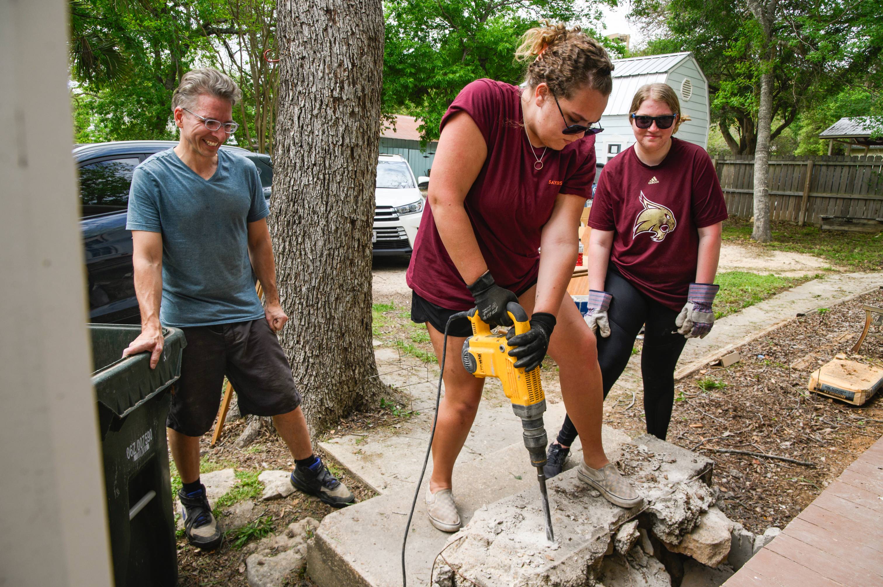 txst faculty and staff using a jackhammer 