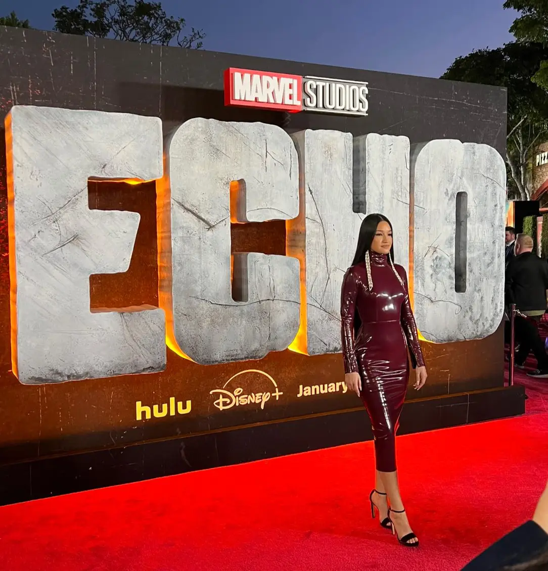 Dannie McCallum poses for photos on the red carpet at the "Echo" premiere.