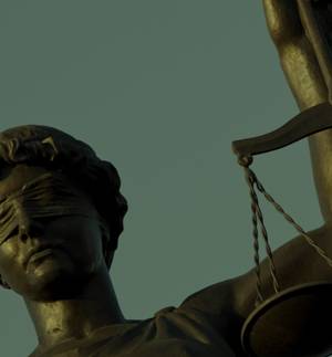 blindfolded lady justice holding scales of justice
