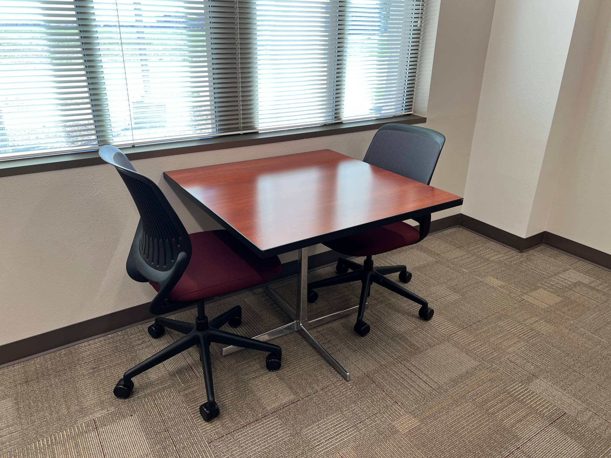 a table with two chairs facing each other