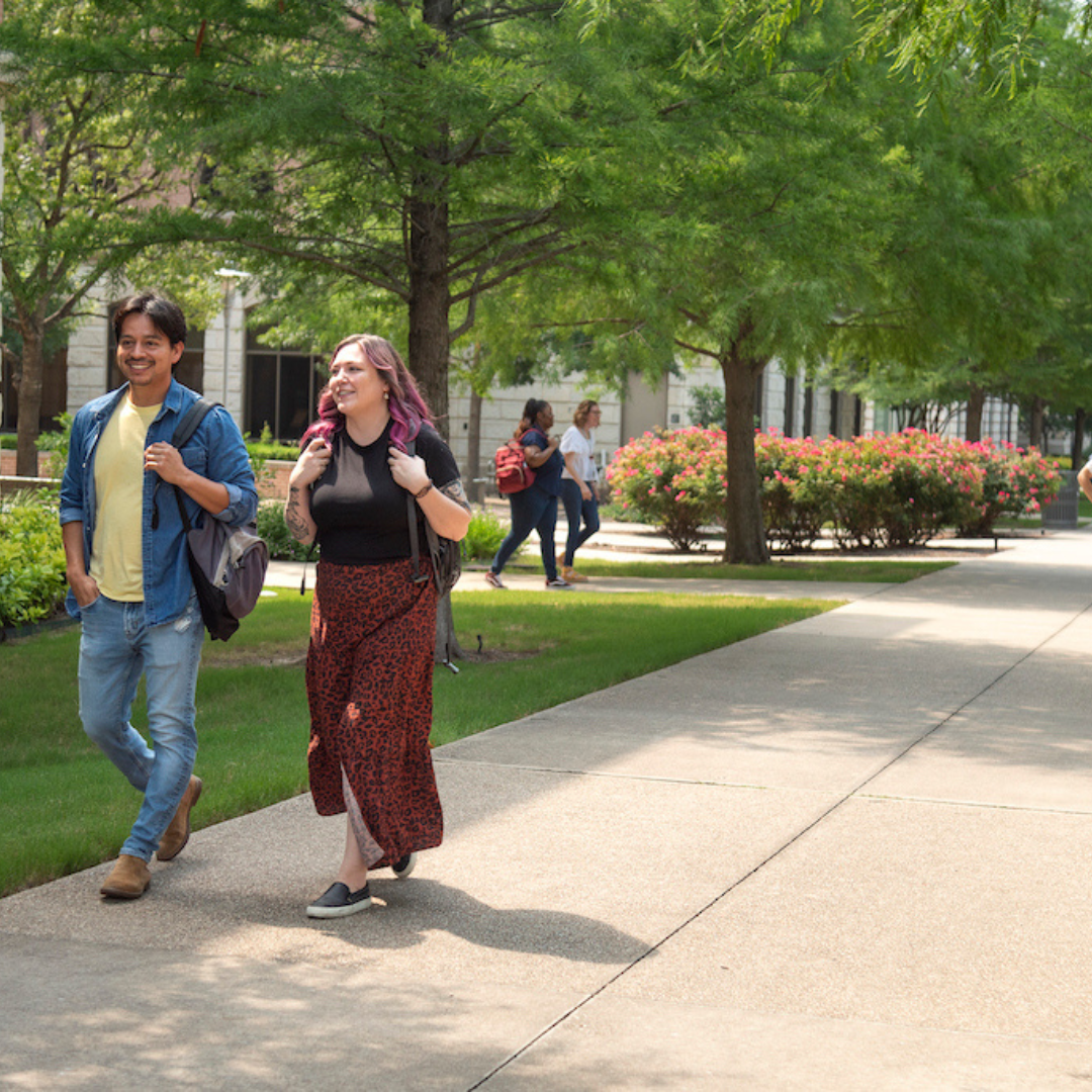 Students walking on the TXST Round Rock Campus