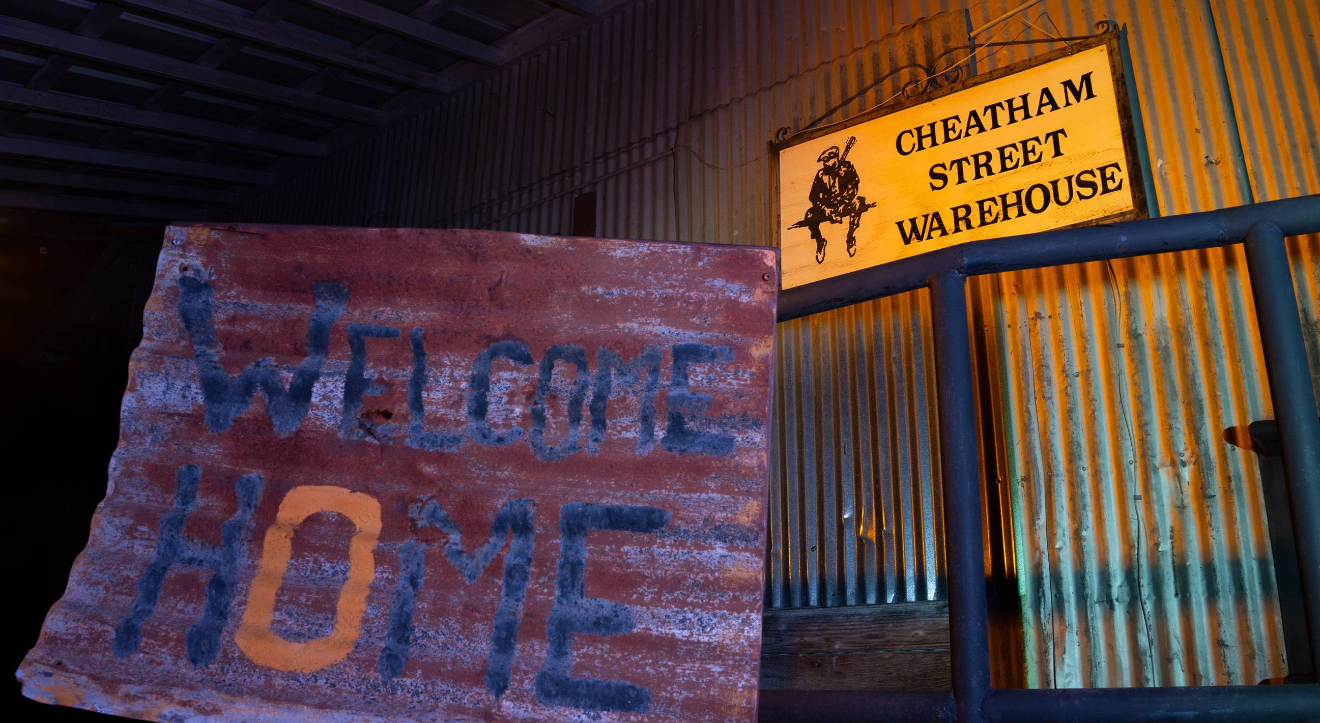 sign reading "welcome home" outside of cheatham street warehouse
