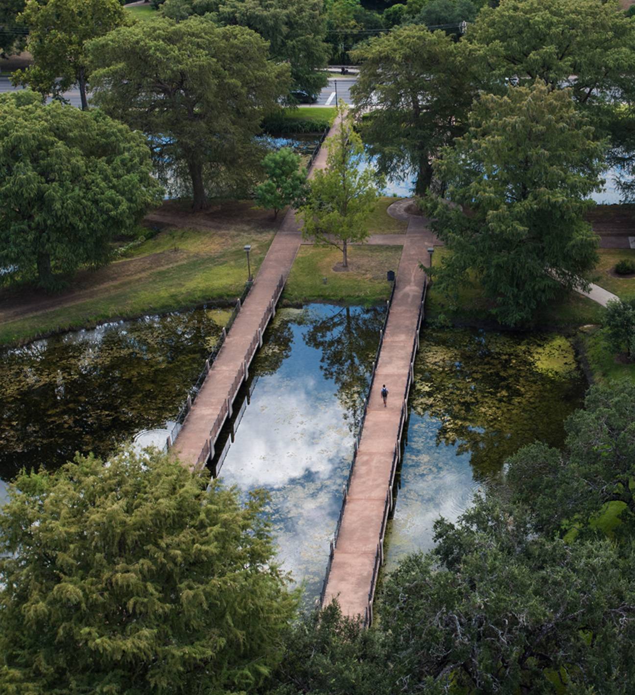 aerial view of two walkways over a body of water