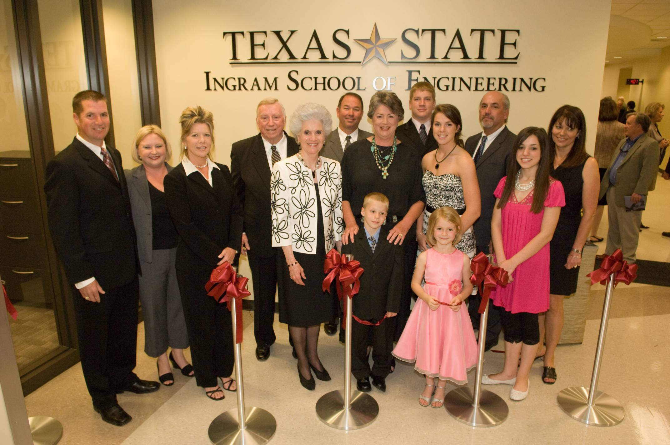 The Ingram family posing for a photo at the grand opening of Ingram Hall.