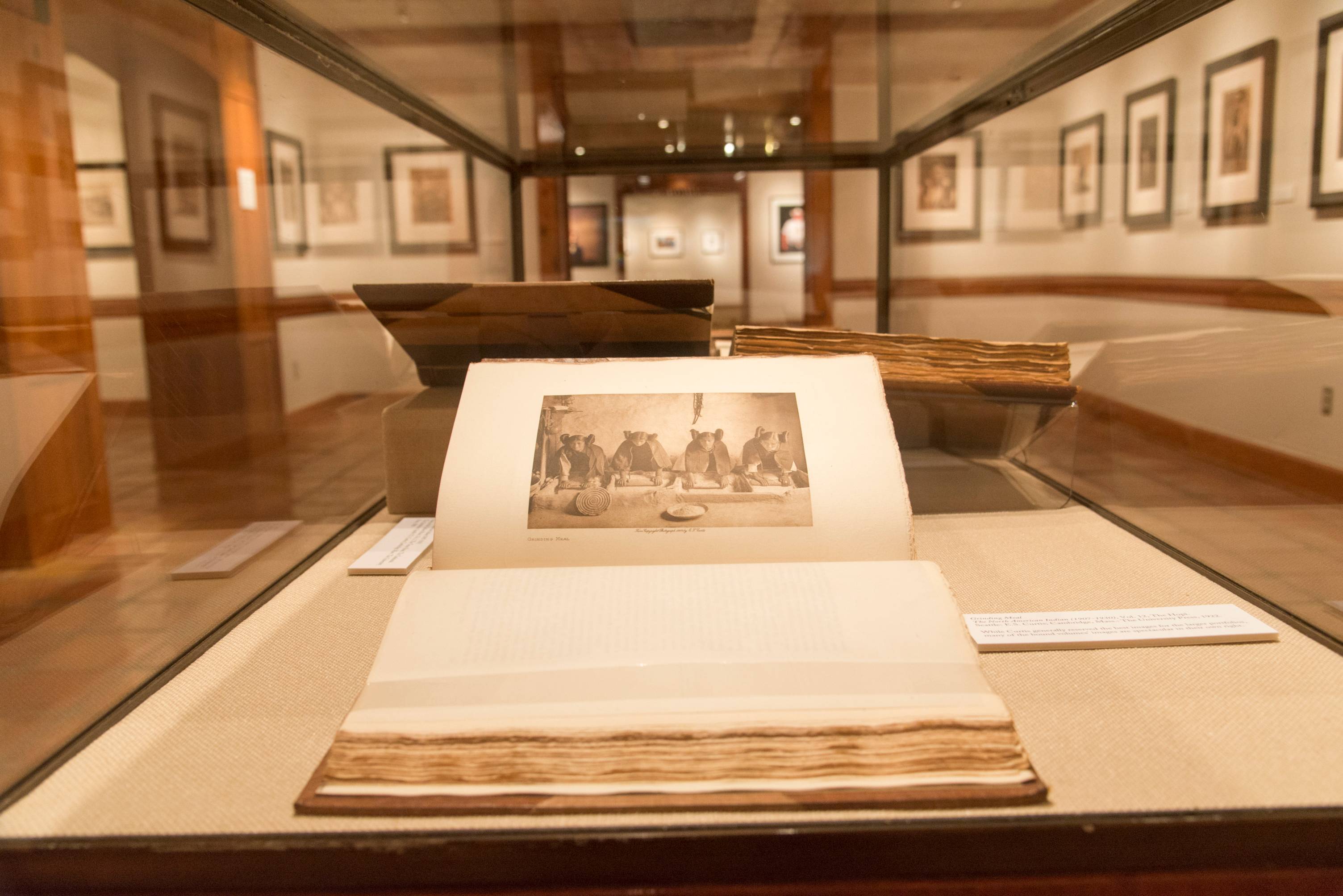 A photo of an exhibit that captures images of the indigenous peoples of America. 