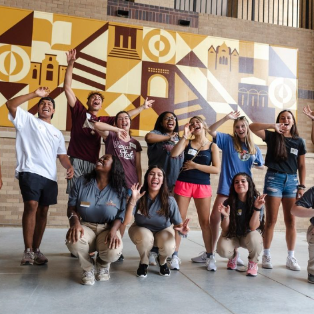 New TXST students at their New Student Orientation posing outside with their group members