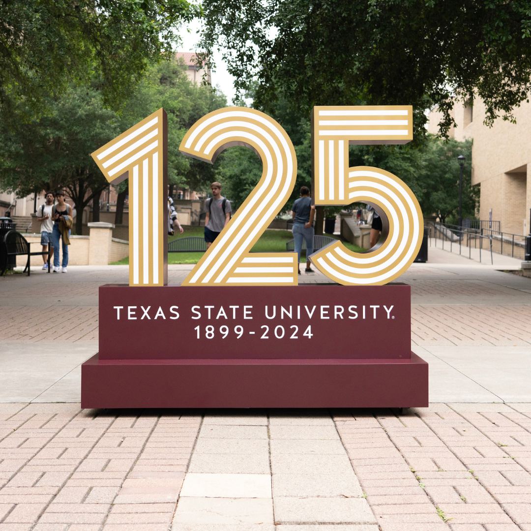 Sign of sculpture of 125 Texas State University 1899 - 2024 links to: 125.txst.edu