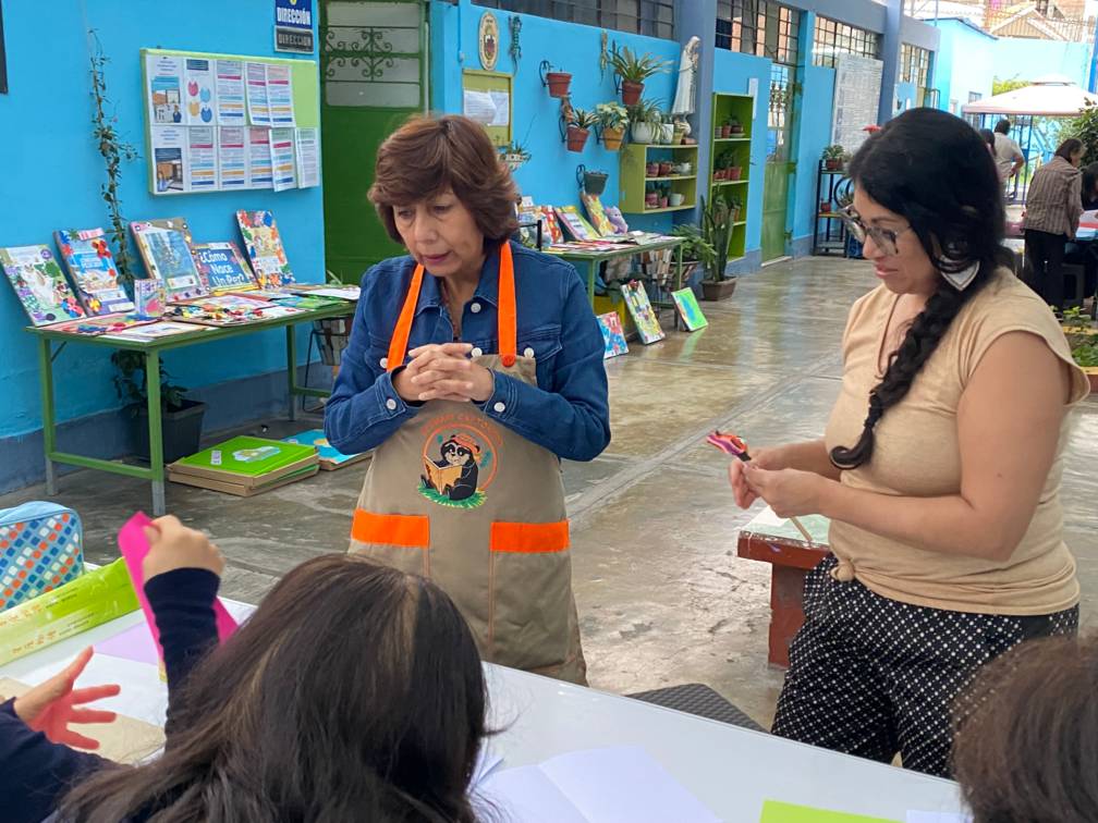 Nancy and Teacher working with students