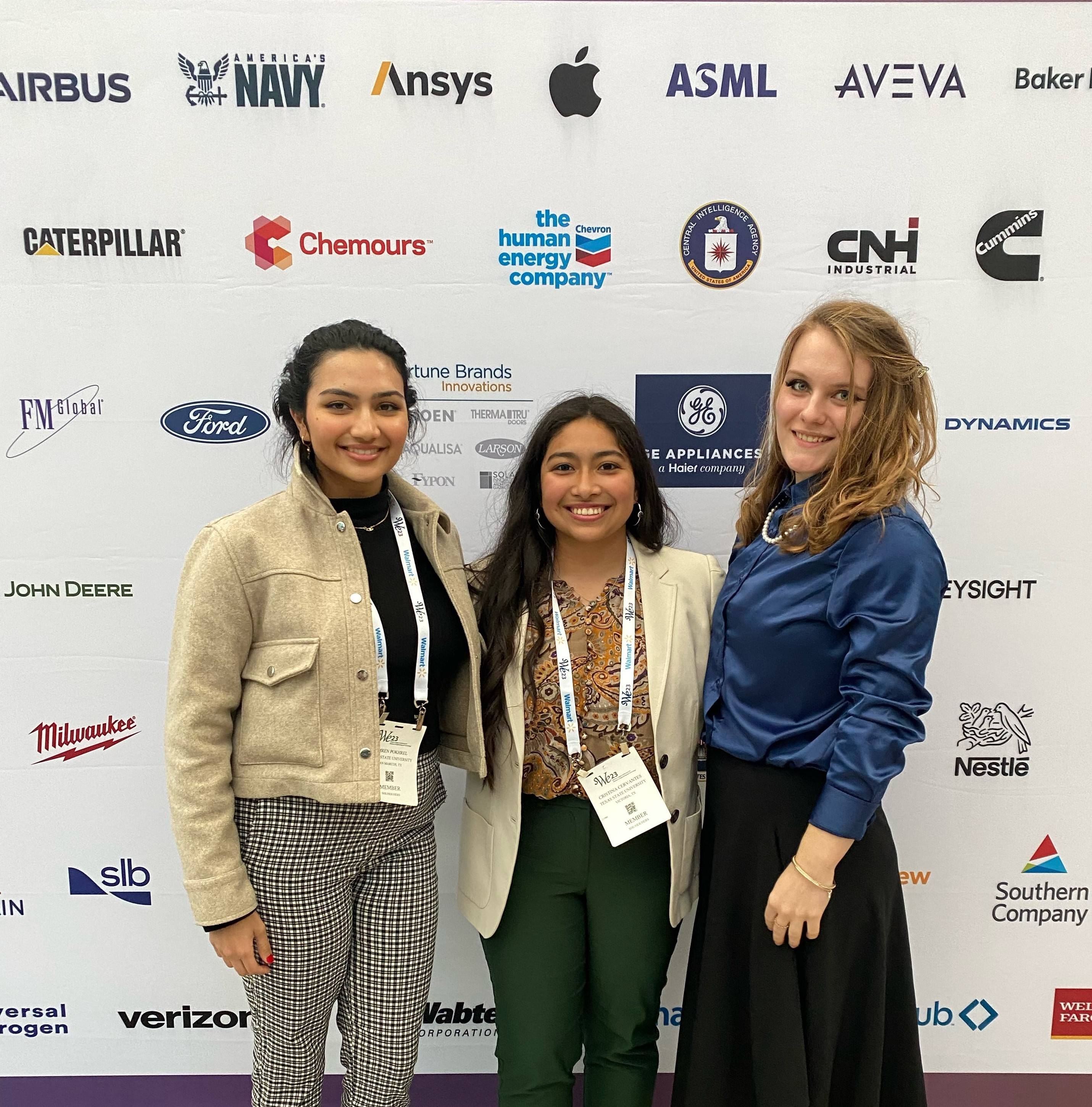 Three students posing 
