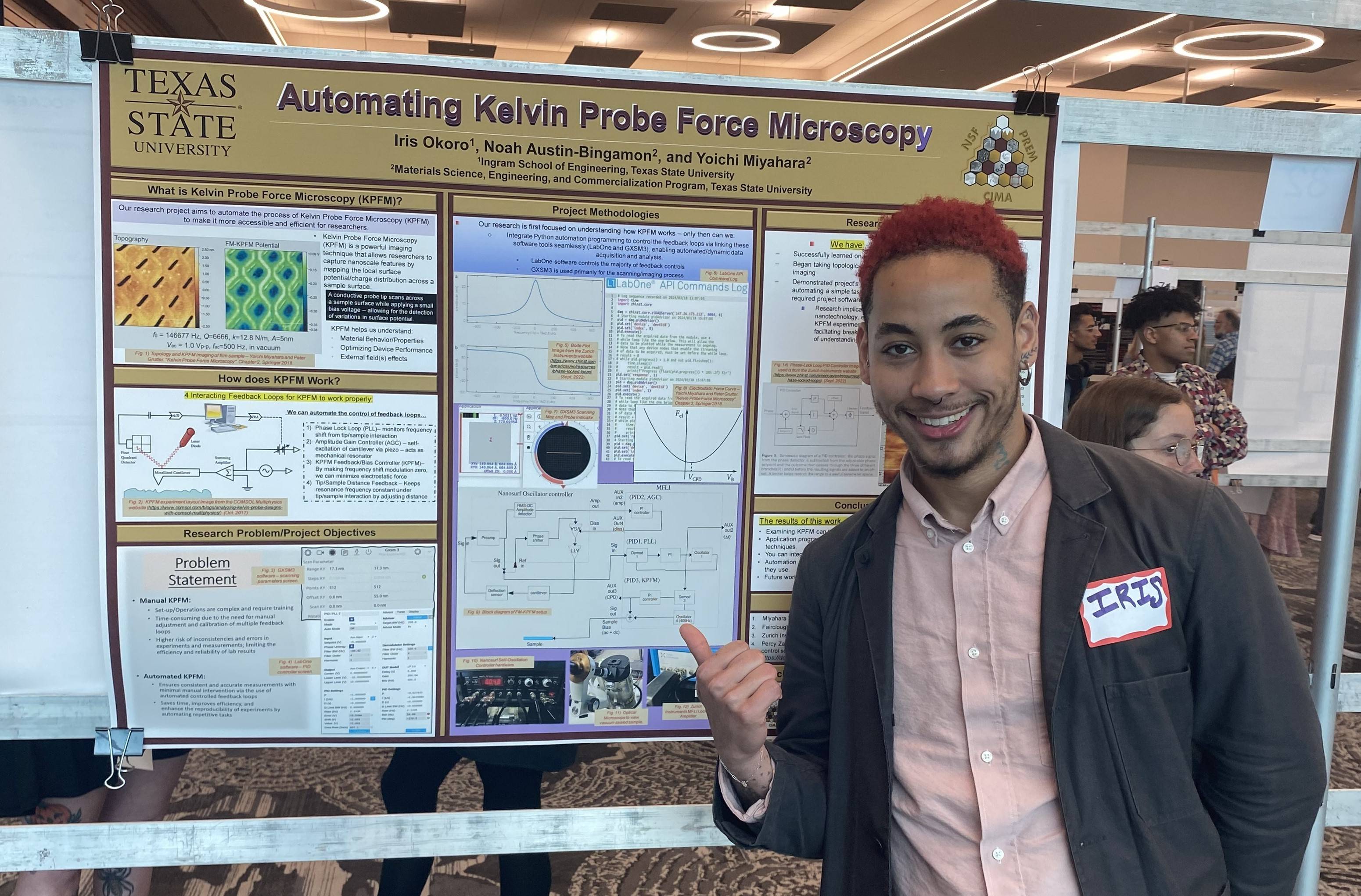 engineering student in front of poster and doing presentation 