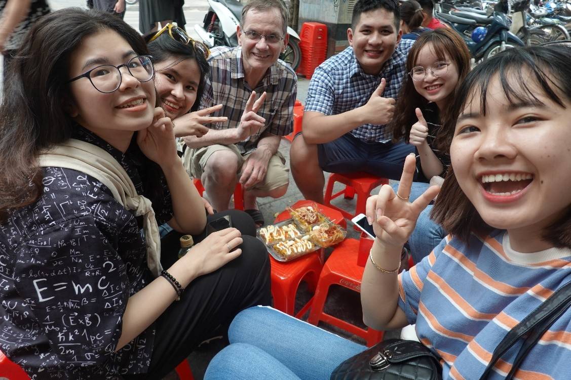 Dr. Jantz shares street food with students from his host university