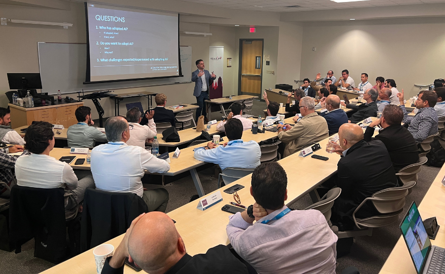 Dr. Josh Daspit speaking to attendees in a classroom.