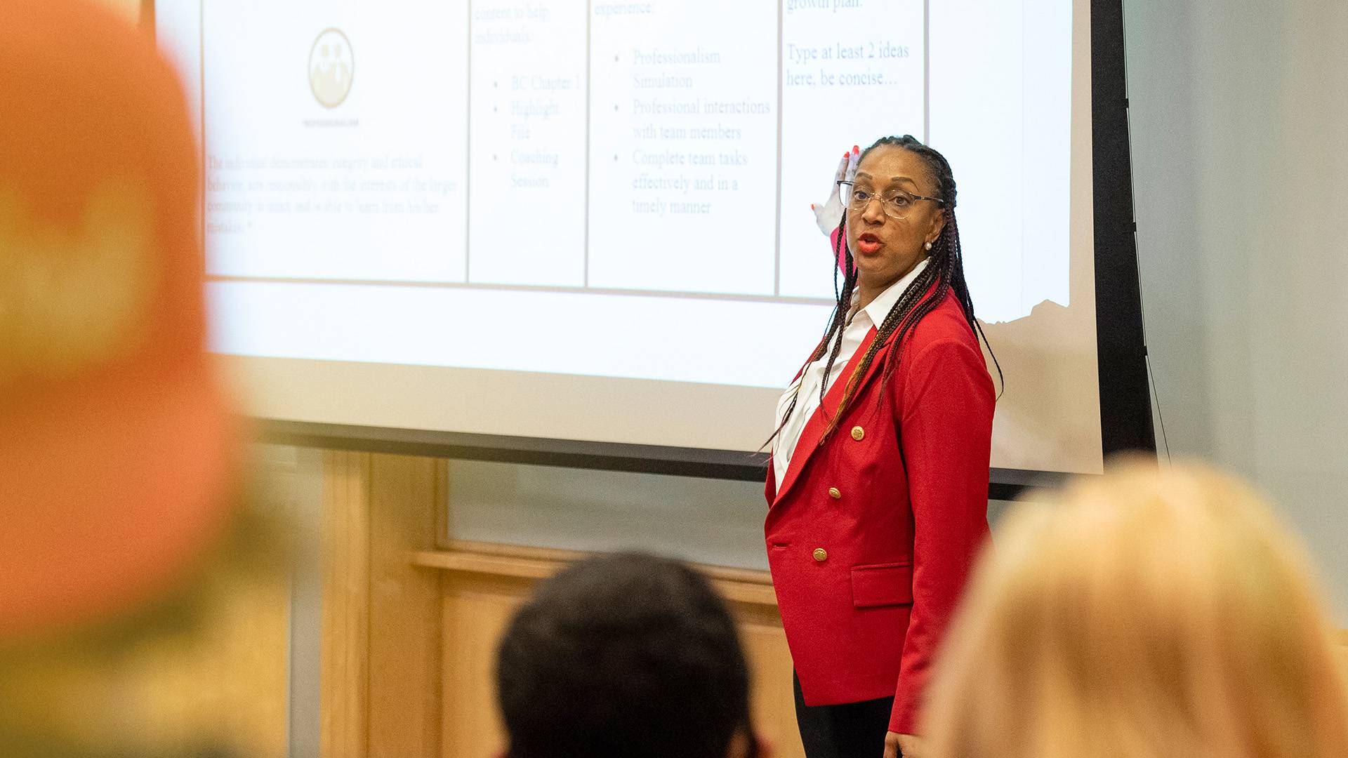 Professor teaching in classroom at McCoy Hall