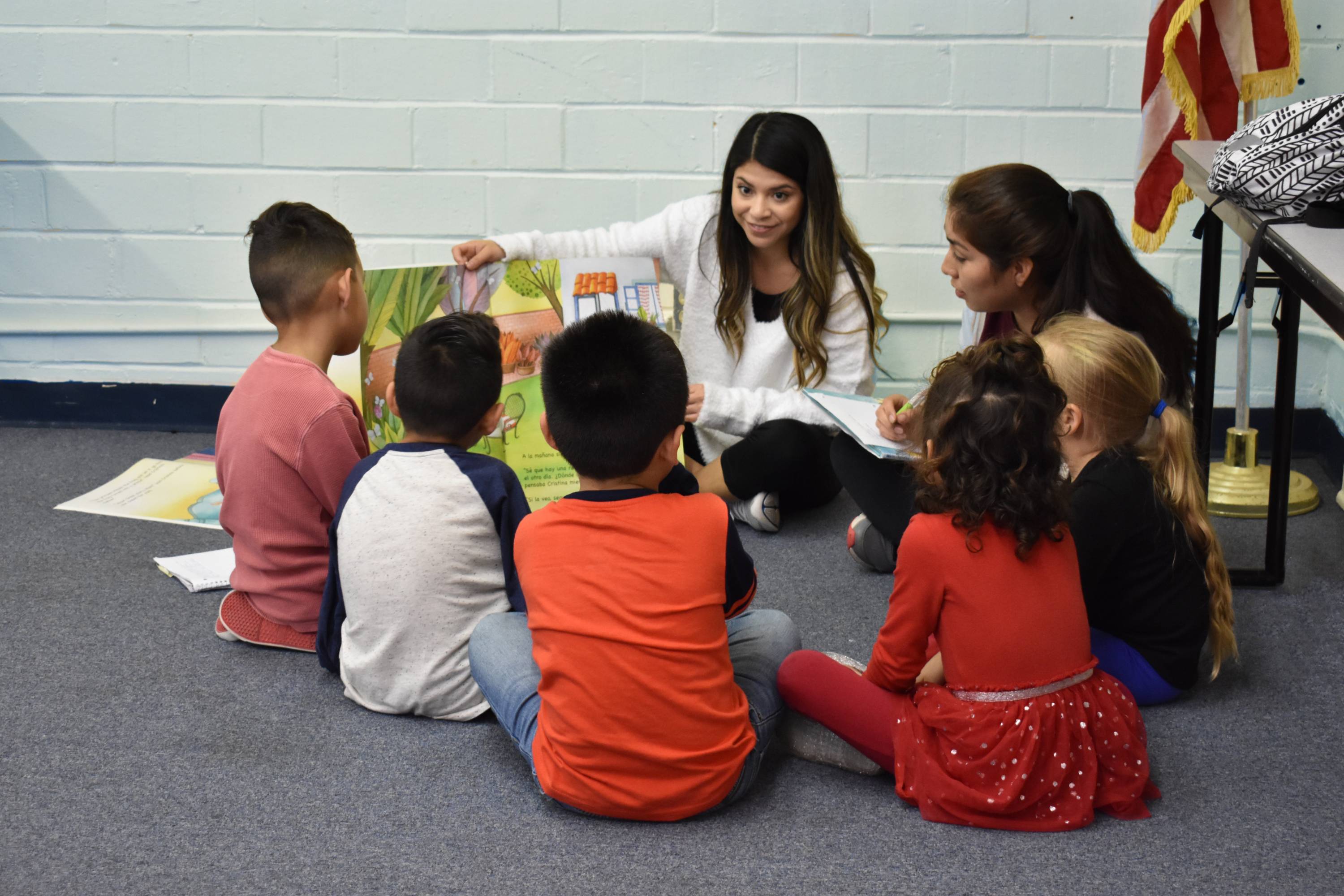 students read to children