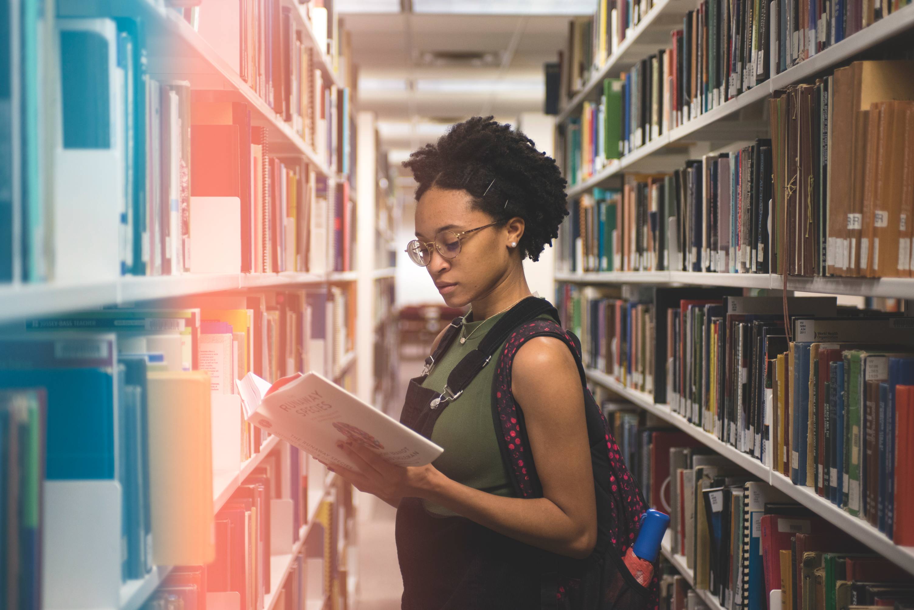 Student checking out book