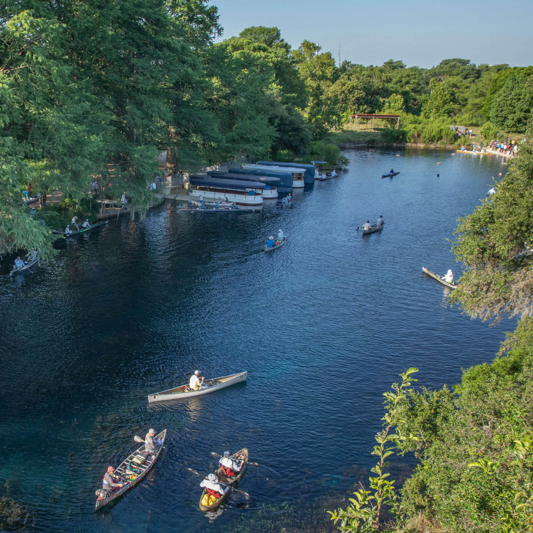 Canoe boast in Spring Lake at The Meadows Center on Texas State's campus prior to the start of the Texas Water Safari