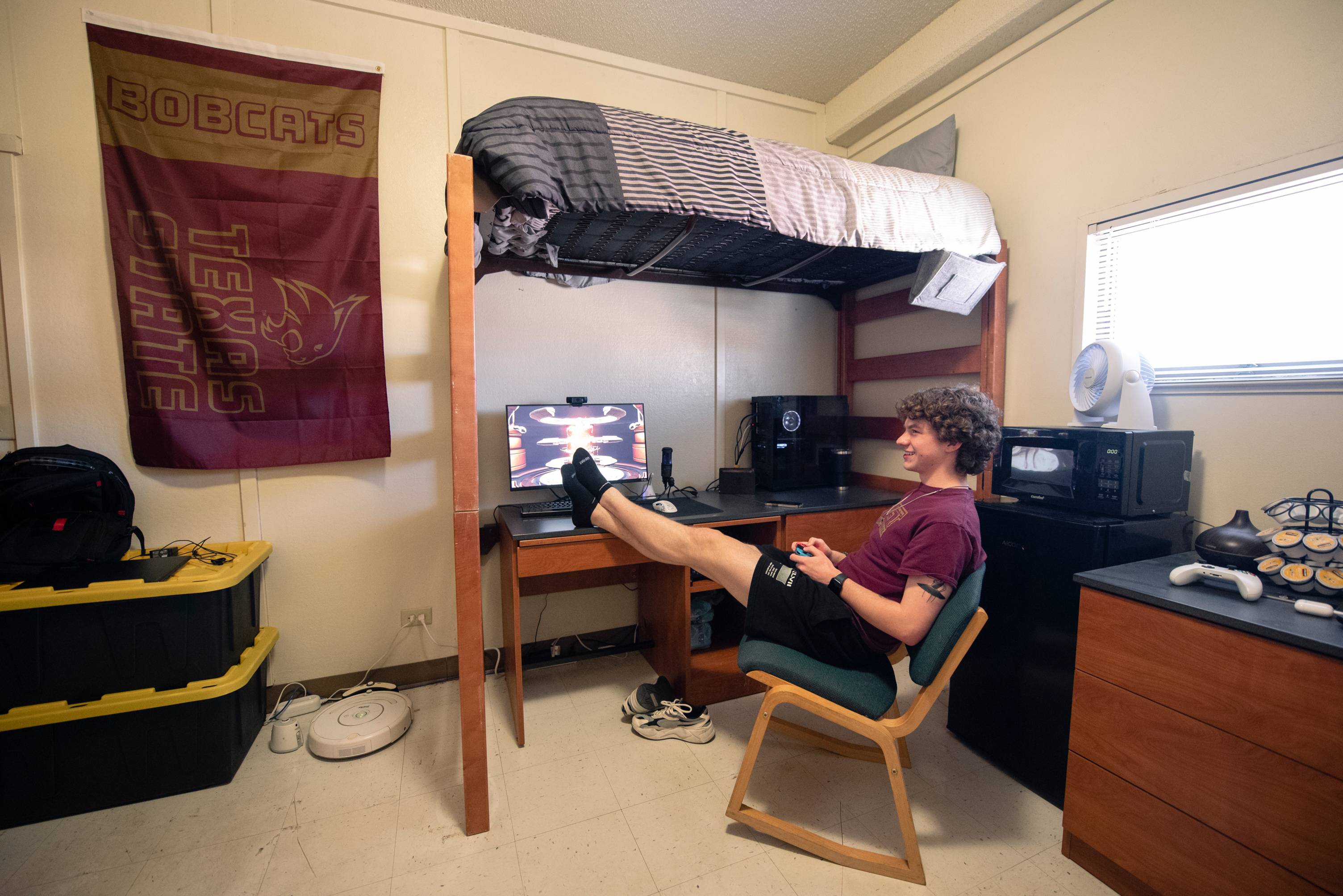 man sitting in chair playing video games