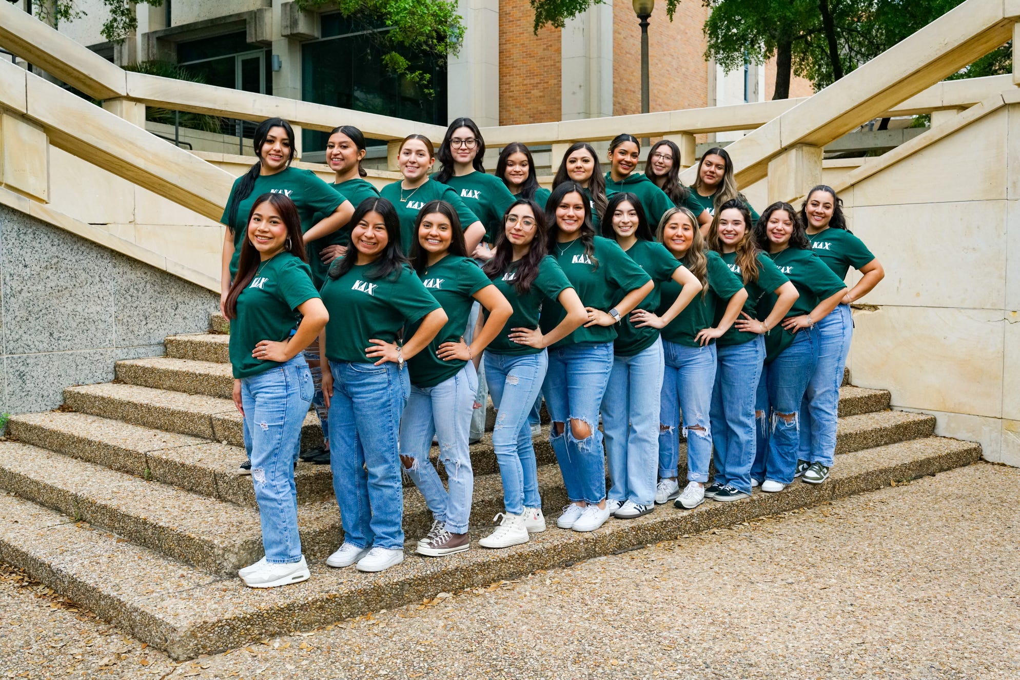 Women of Kappa Delta Chi all matching wearing jeans and matching green t-shirts