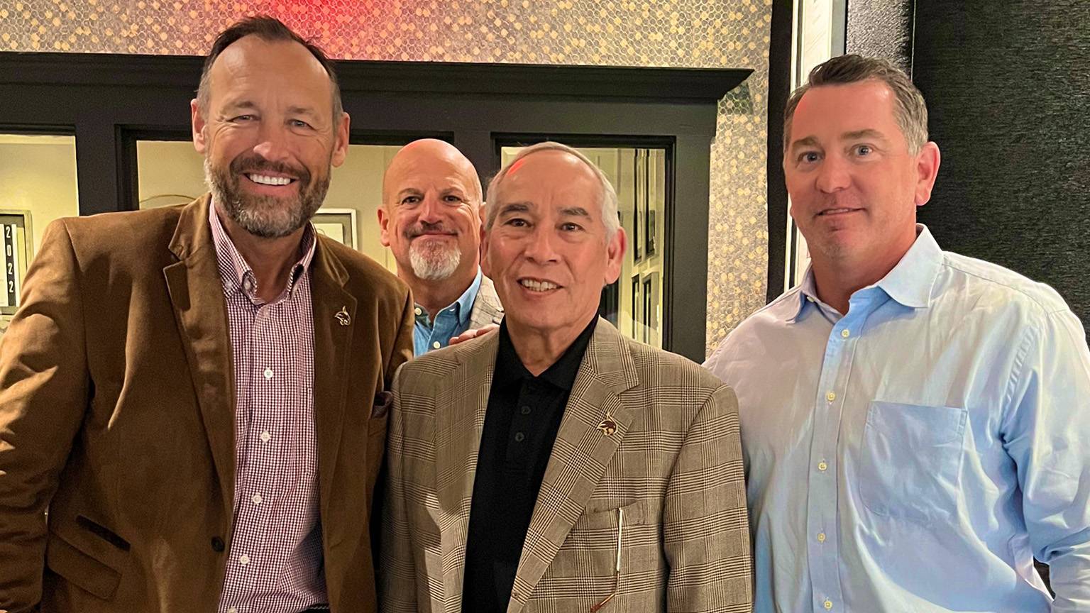 President Damphousse (left) poses for a photo with Brooks Hull, Don Flores, and Travis Comer.