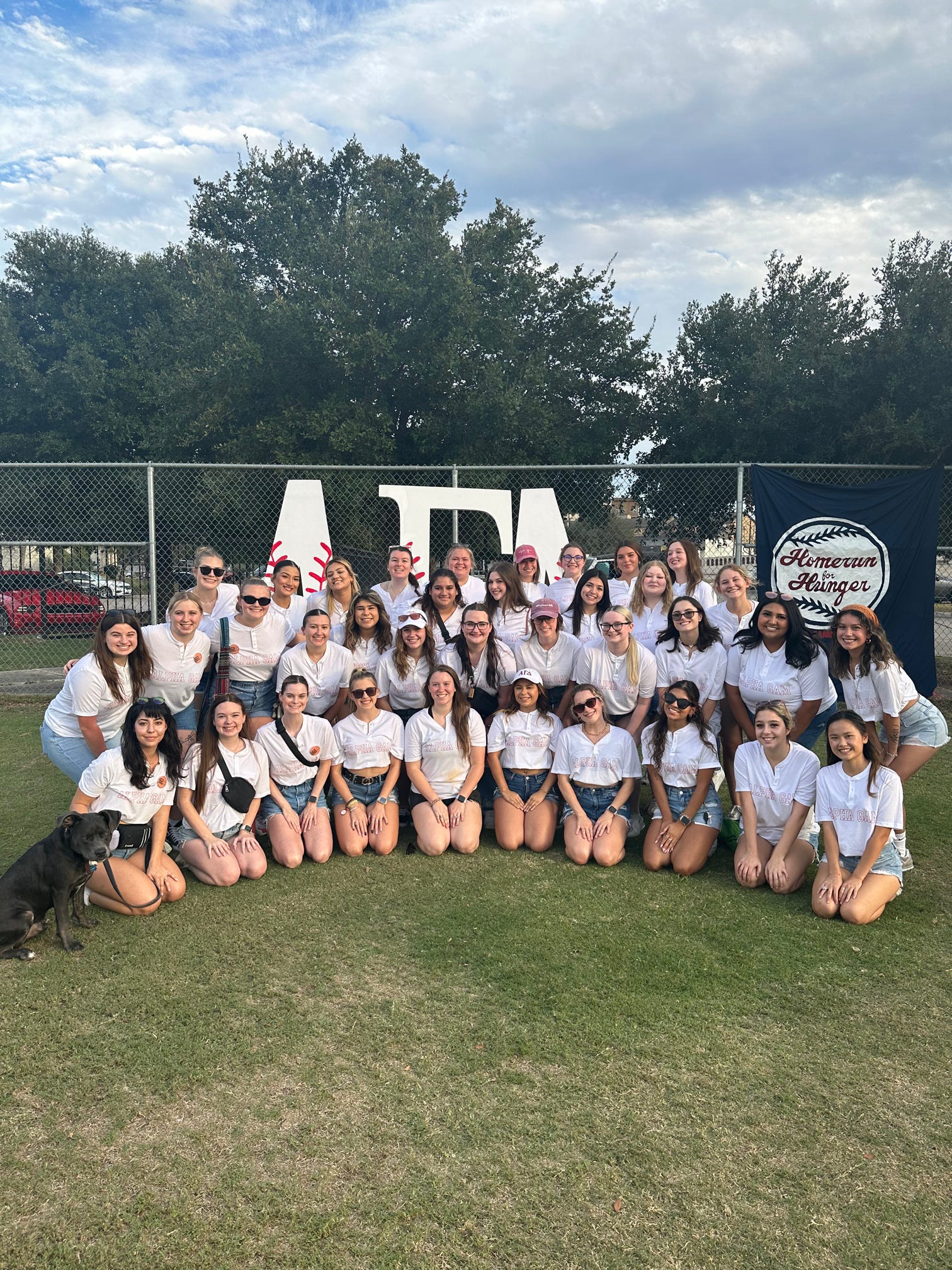 Women of Alpha Gamma Delta walking on a trail