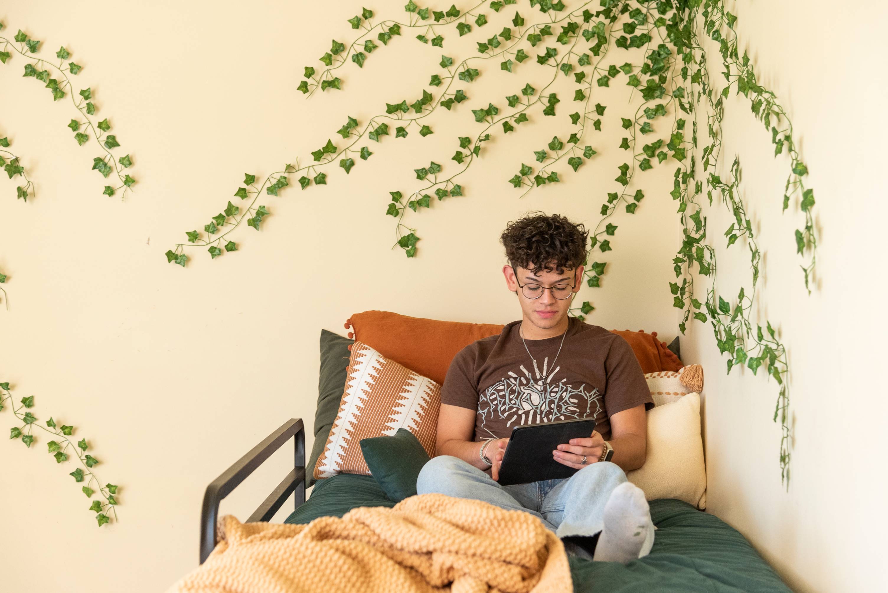 student sitting in bed