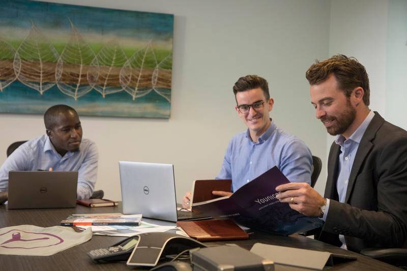 Three people working at a table