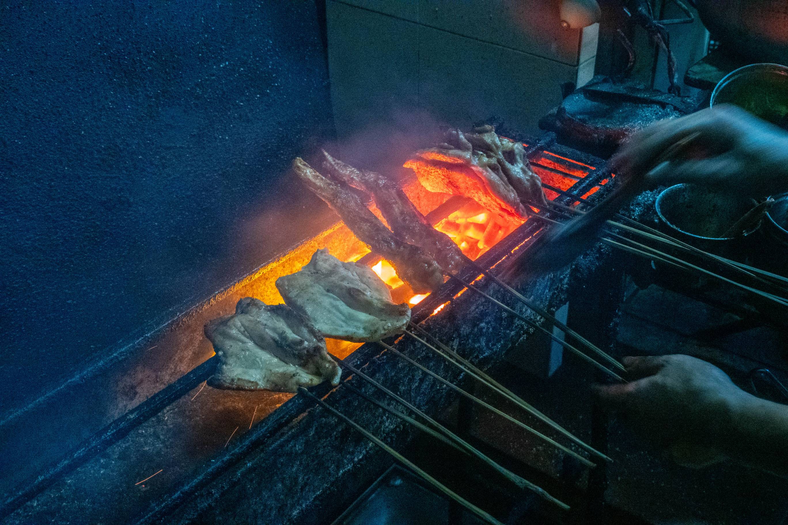 chicken roasting over open pit