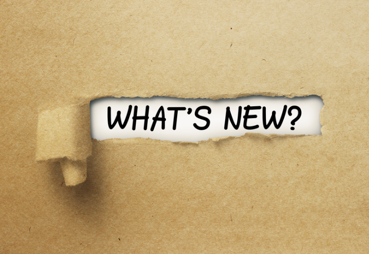brown paper torn back to reveal the words "what's new?"