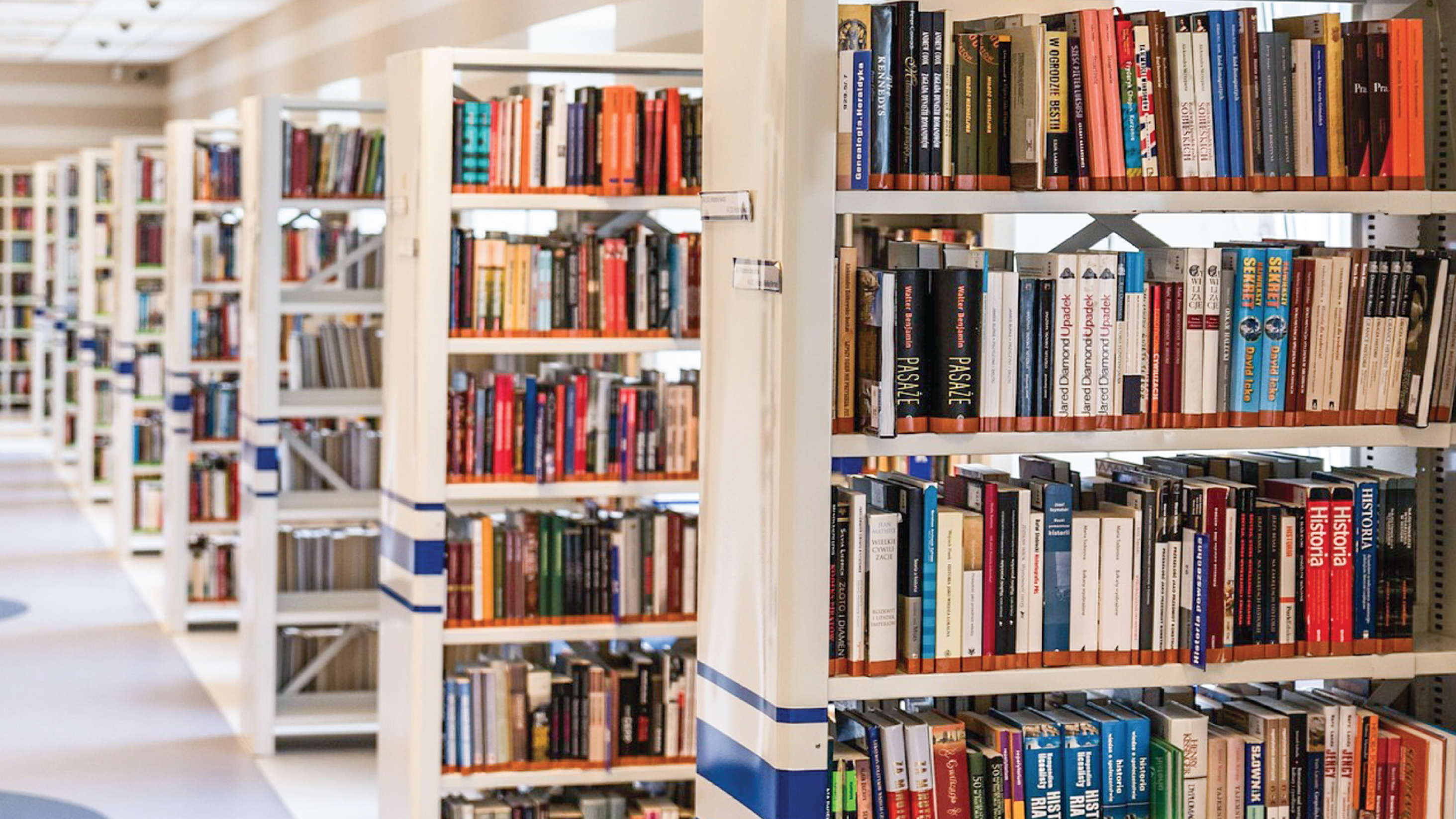 An image of a row of bookshelves in a library.