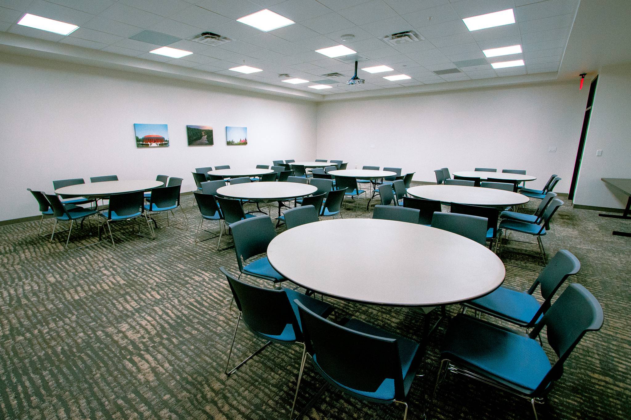 A room with chairs and tables