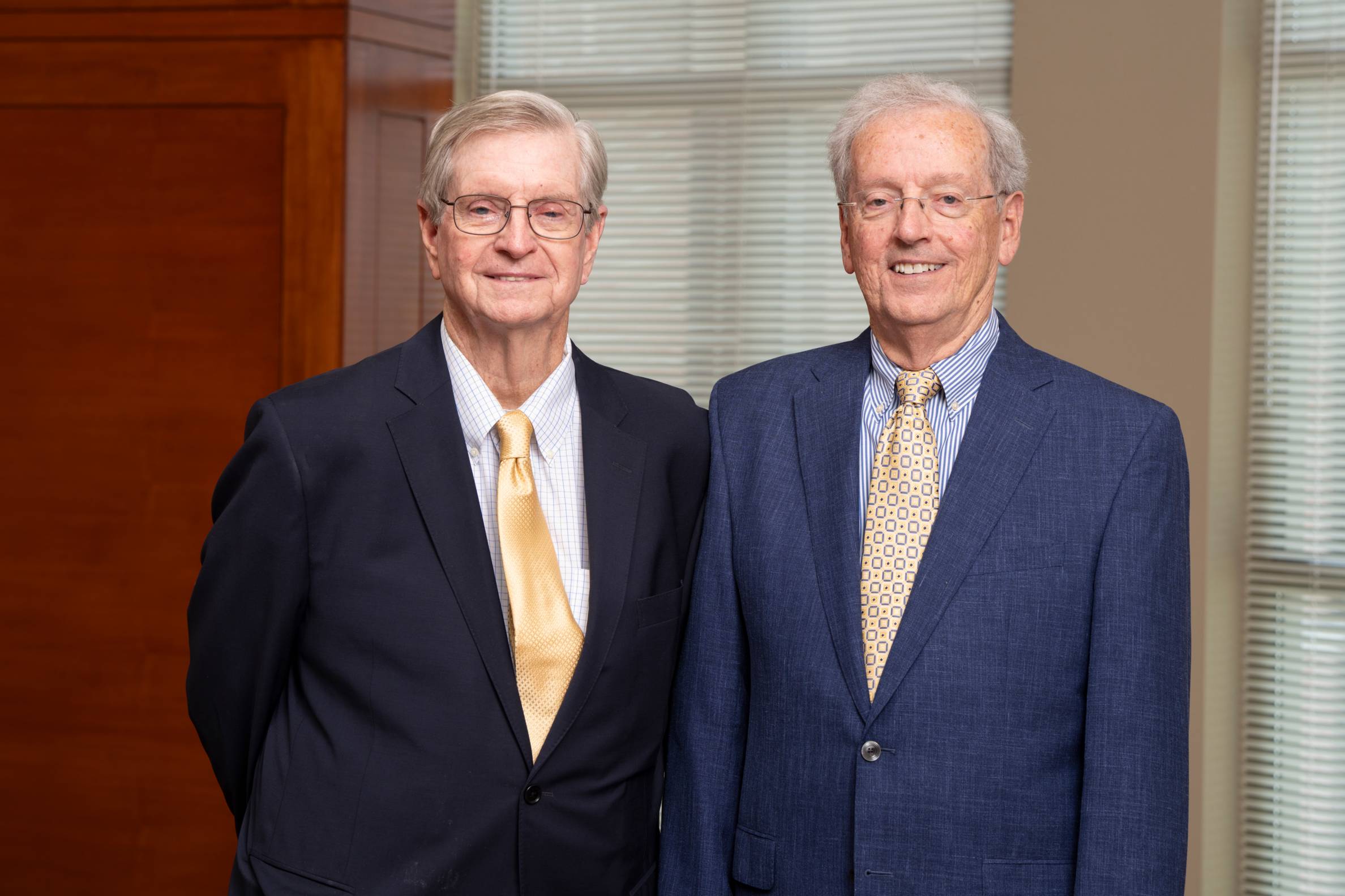 two men standing next to each other