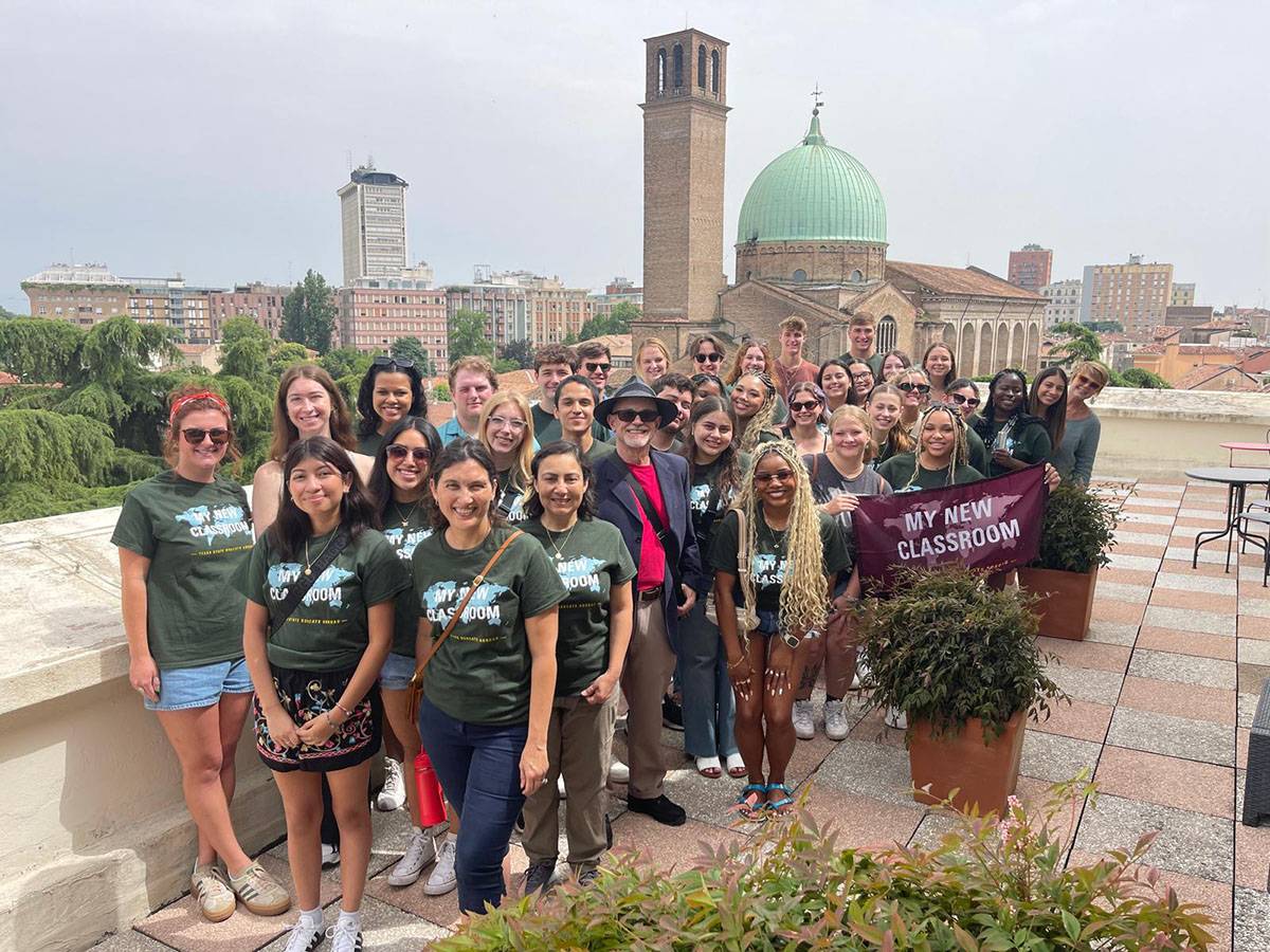 A large group of TXST students and faculty pose for a picture in Italy.