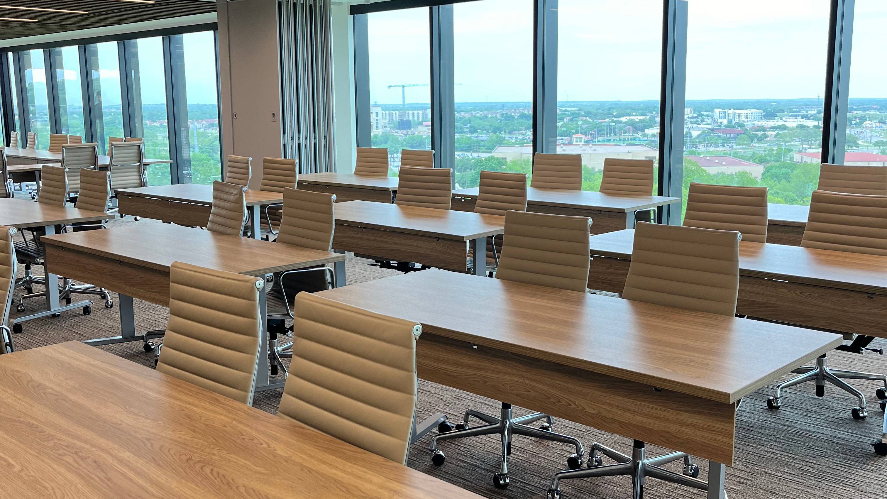 A meeting room with tables and chairs