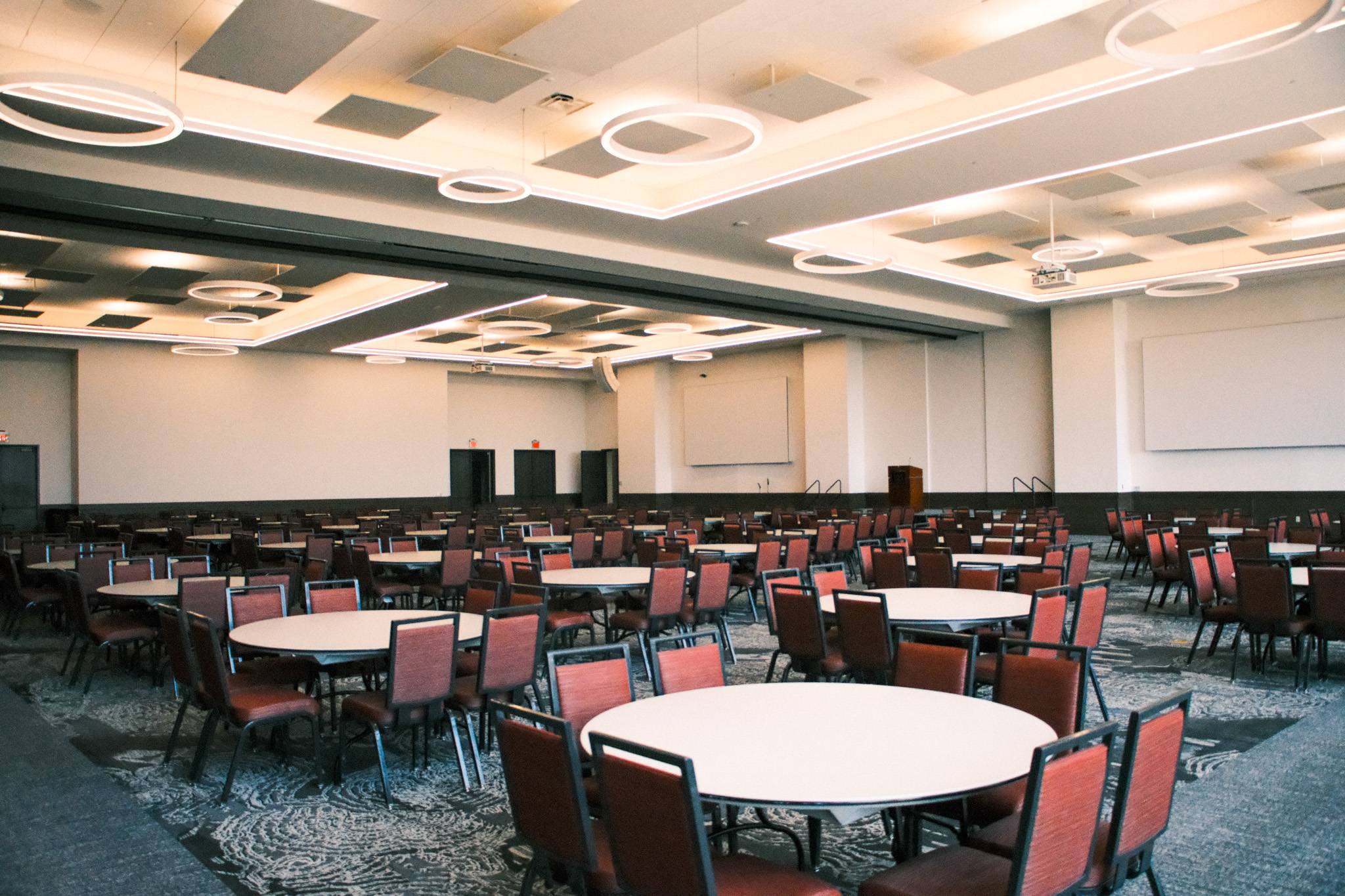 Grand ballroom with tables and chairs