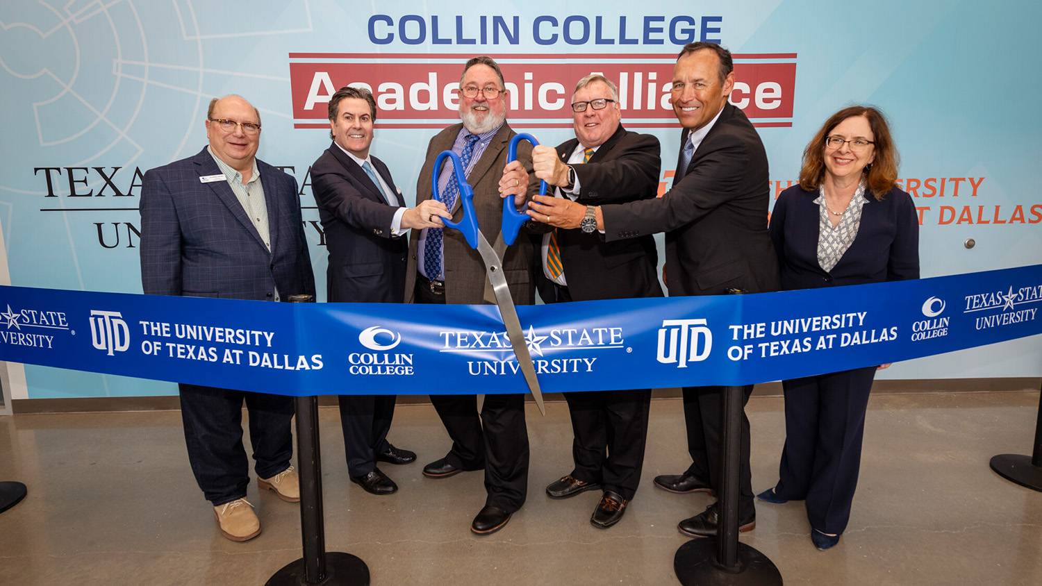 Pictured cutting a ceremonial ribbon for the partnership are (from left) Collin College Board of Trustees Chair Andrew Hardin, Texas State University (TXST) System Chancellor Dr. Brian McCall, Collin College District President Dr. Neil Matkin, The University of Texas at Dallas (UT Dallas) President Dr. Richard Benson, TXST President Dr. Kelly Damphousse, and UT Dallas Provost Dr. Inga Musselman.