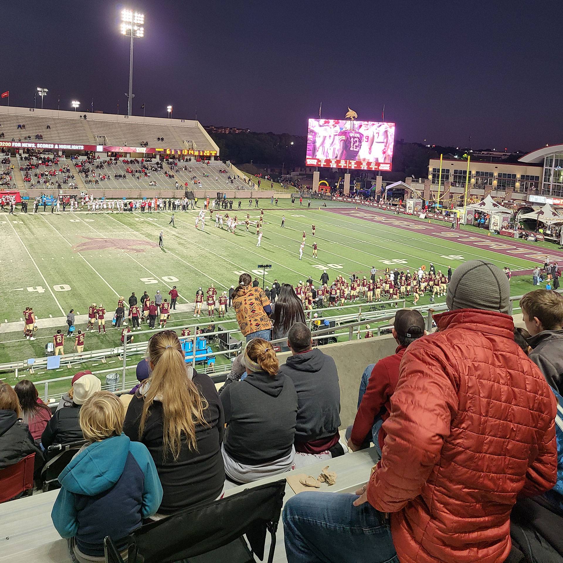 A photo overlooking a TXST football game from the stands