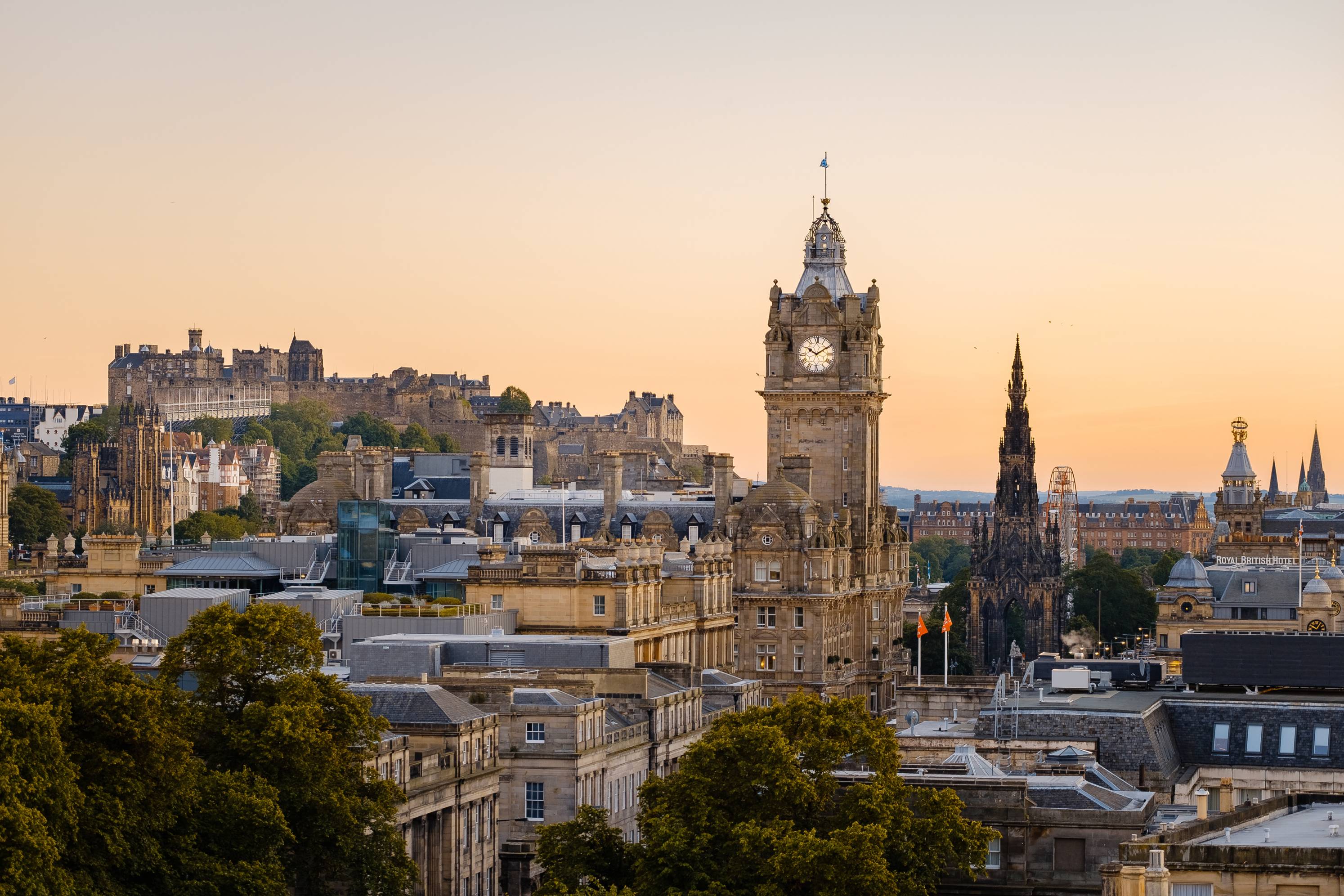 Aerial view of Edinburgh skyline featuring the Balmoral Hotel Clock tower.