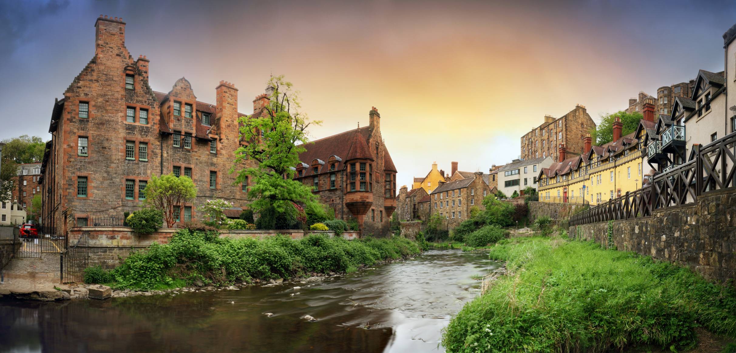 Dean Village at sunset following the Waters of Leith a previous water milling site.