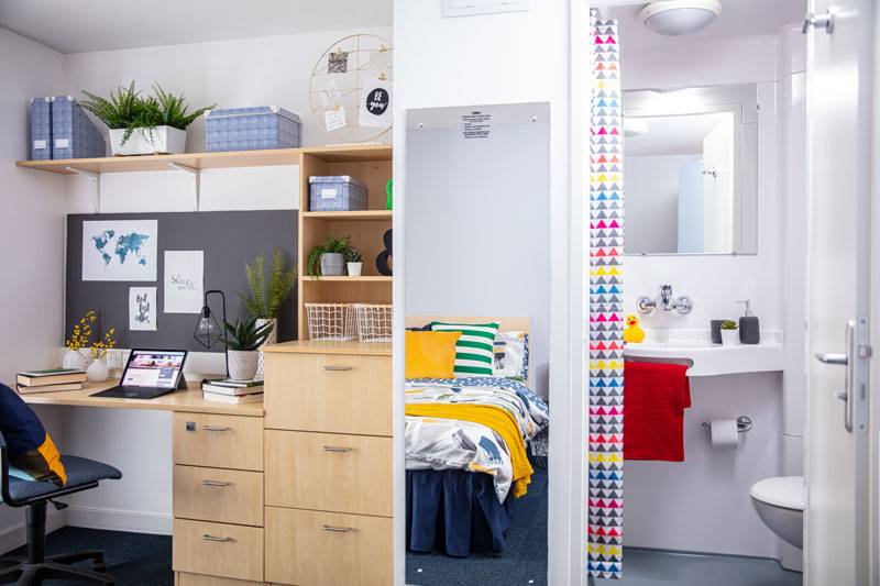 interior of decorated student's private room- desk and bathroom.