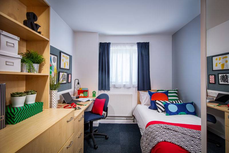 interior of decorated and furnished student's private bedroom.