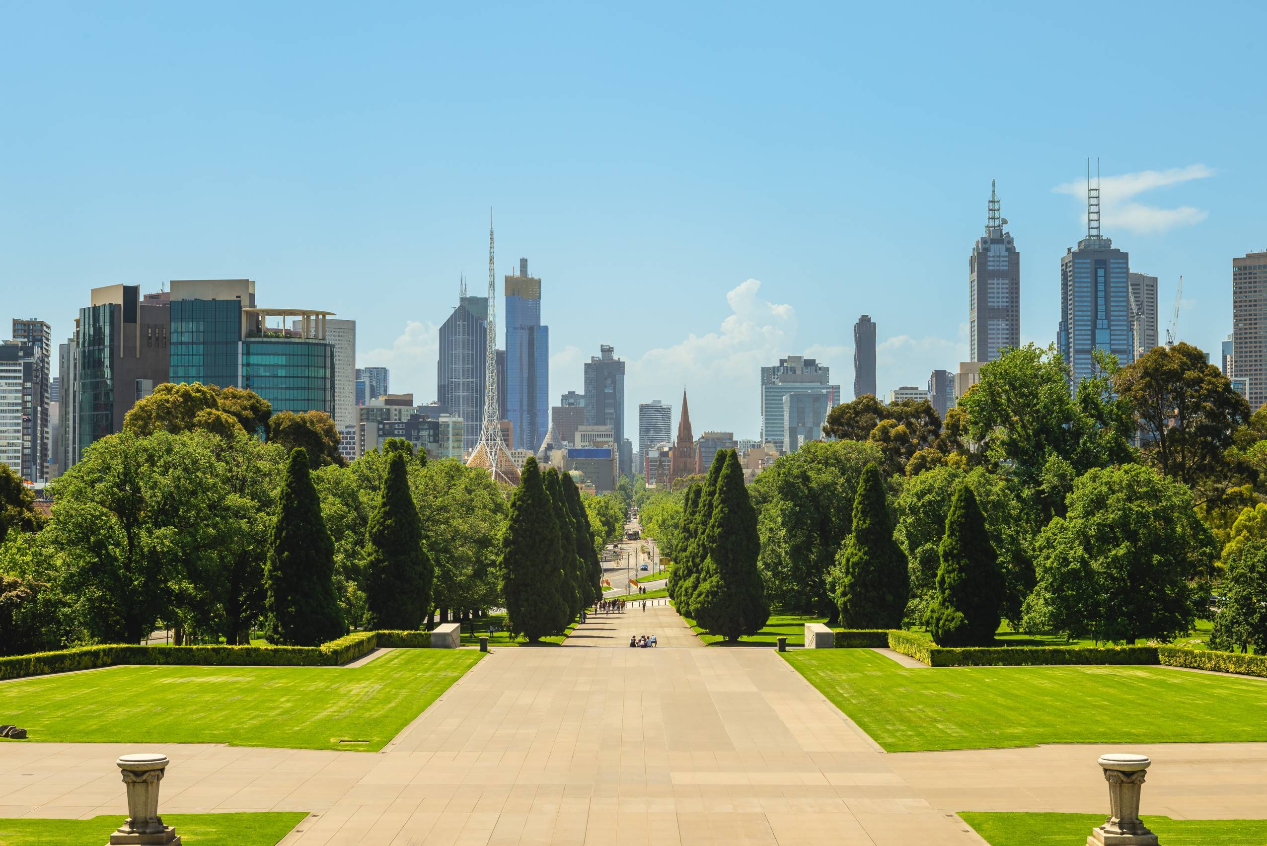 Distance view of melbourne city skyline from city green space.